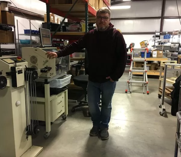Chris runs our wire cutting machine and crimp center in our Cable Department.